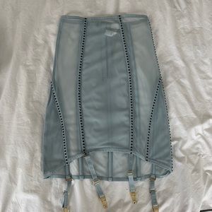 NWOT. La Perla sheer skirt. Never WORN. Size 2. Garter connects at the bottom.